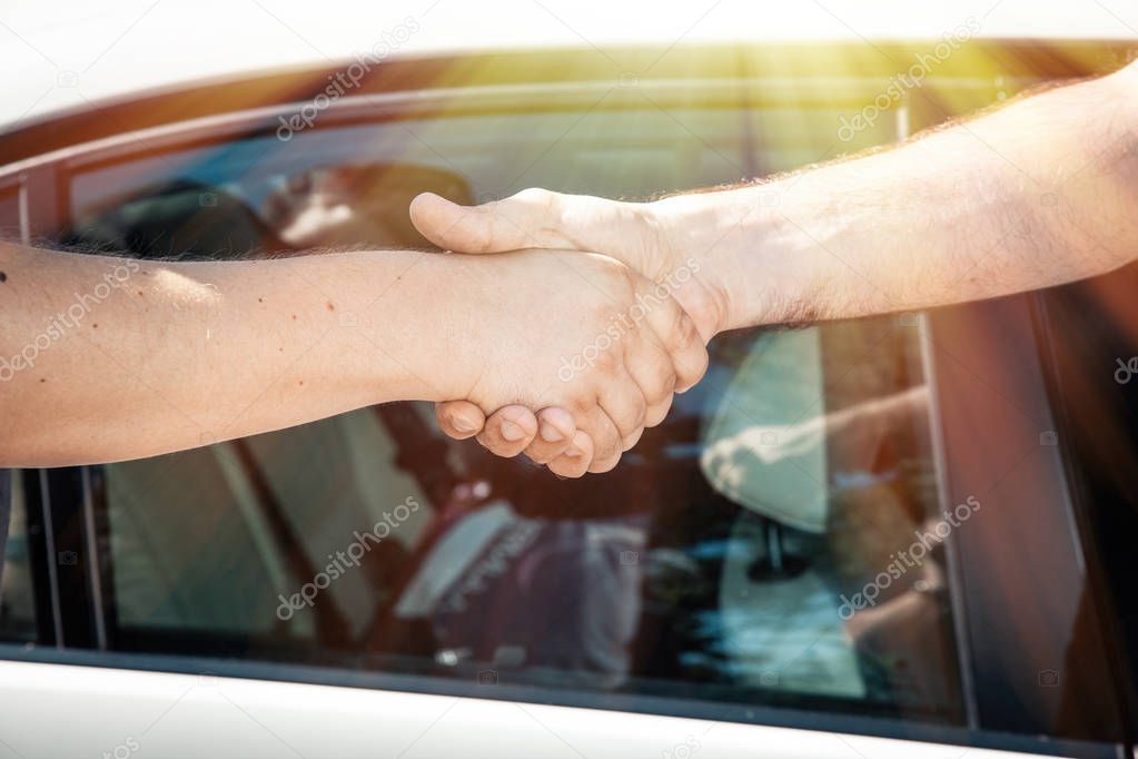 Businessmen have agreed on a deal and shake hands