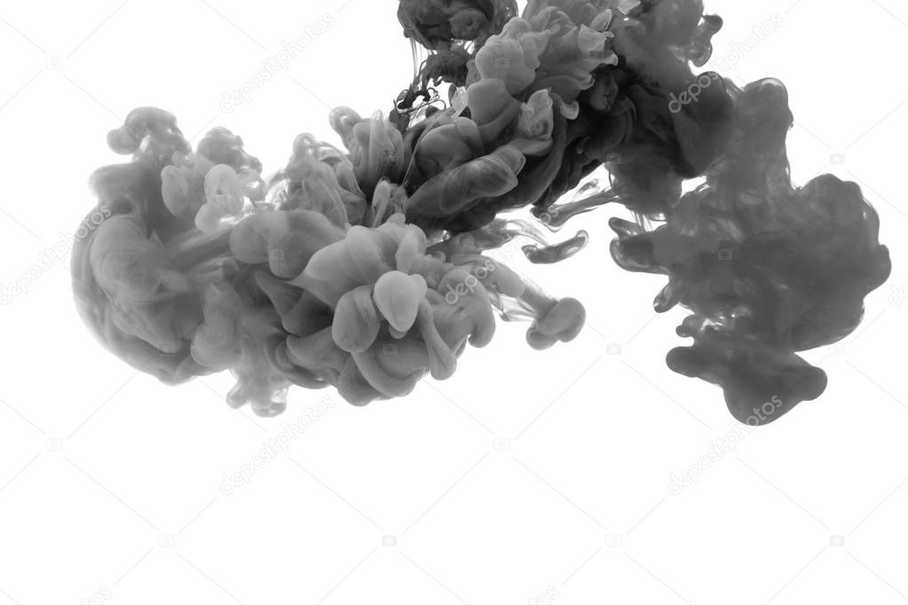 Ink in water. Abstract background. . Ink swirling in water. Ink in water isolated on white background. Black ink in water.