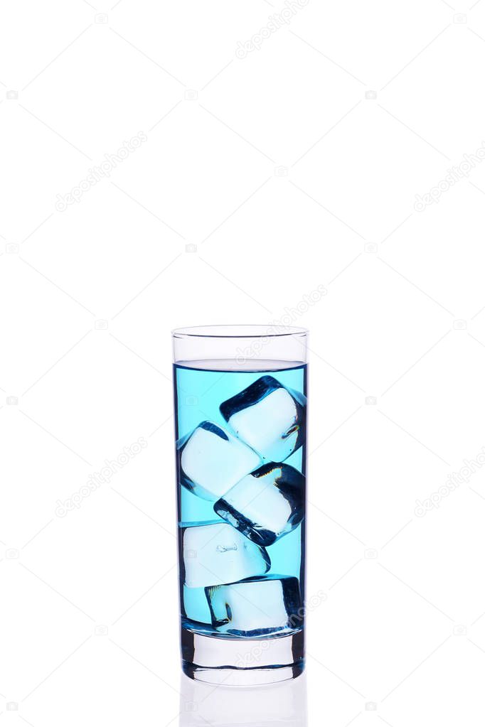 Glass beaker is filled with a blue cocktail ice cubes on a white background isolate.