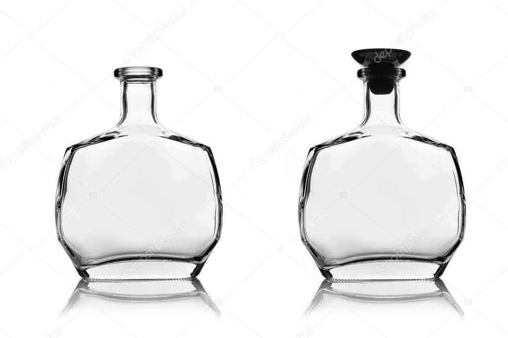 Empty alcohol bottles open and closed by transparent glass.