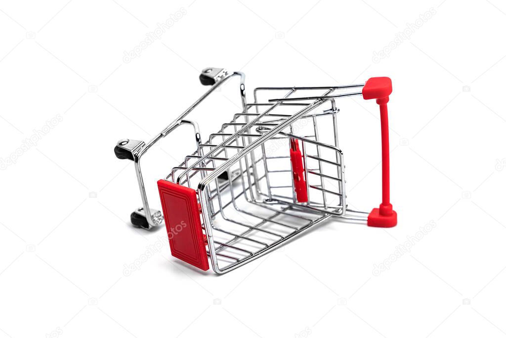 Empty aluminum shopping trolley close up shot on a white background. Concept idea for a store.