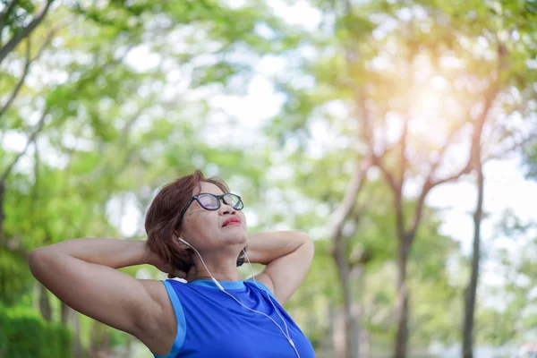 Senior Asian Woman Relaxed Listening Music Park Exercise Sport Activity — Stock Photo, Image