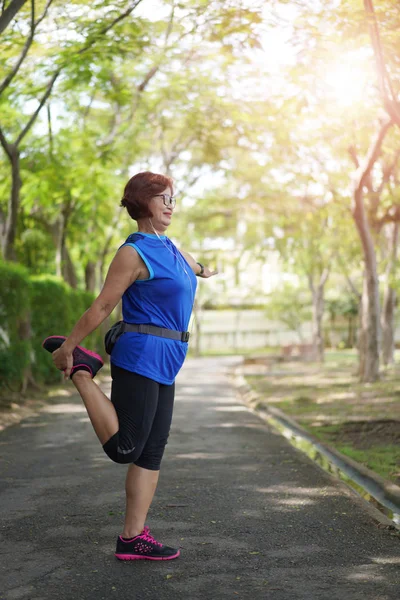 Senior Asian Woman Stretch Muscles Park Listening Music Athletic Senior — Stock Photo, Image