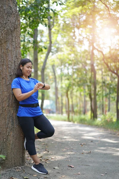 Asian Woman Checking Time Smart Watch Check Heart Rate While — Stock Photo, Image