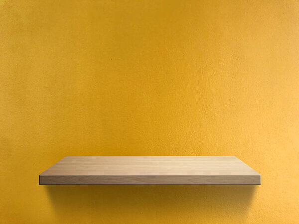 Wood shelf on yellow wall texture background