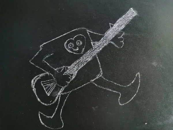 Funny musical cartoon art with guitar drawing on chalkboard for kid education pattern hand created.