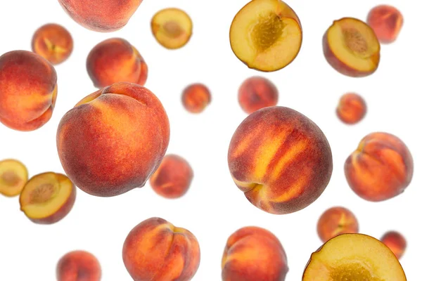 Falling peaches isolated on a white background with clipping path. Flying fruit