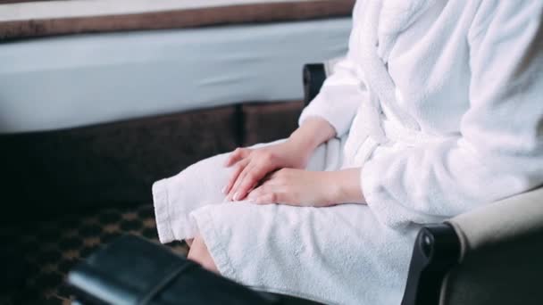 Female Hands Her Knees Girl White Coat Sitting Chair — Stock Video