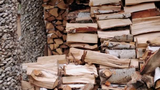 Chopped firewood is a mountain against the background of other firewood — Stock Footage Chopped Firewood Mountain Background Other Firewood Royalty Free Stock Footage