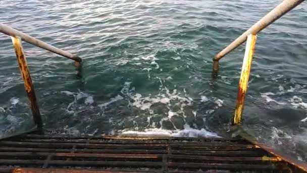 Old Rusty Iron Stairs Handrail Descending Blue Water — Stock Video