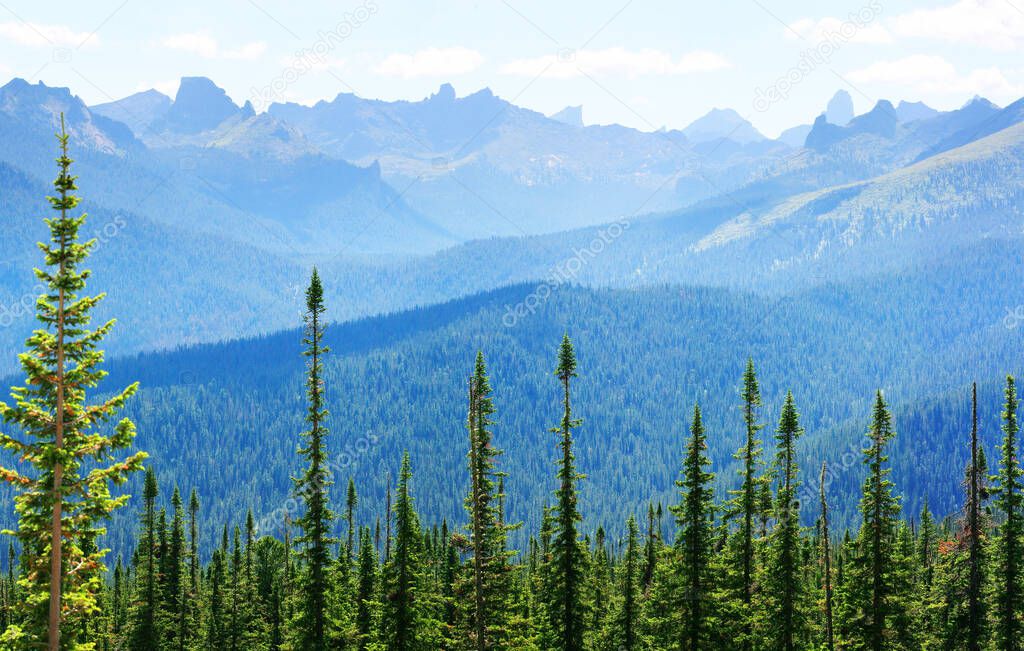 Taiga and the summits of the Sayan Mountains, Natural Park Ergaki. Siberian nature, traveling in Russia.