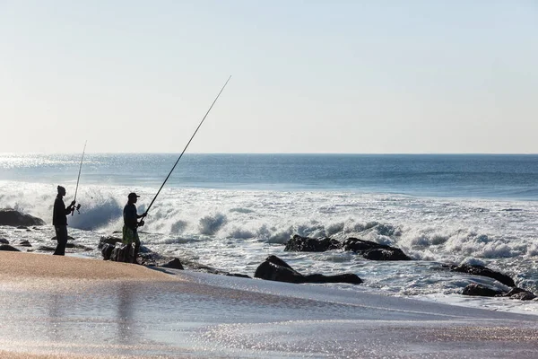 Fishing Beach Coastline Ocean Waves Distant Unidentified Silhouetted Fishermen — Stock Photo, Image