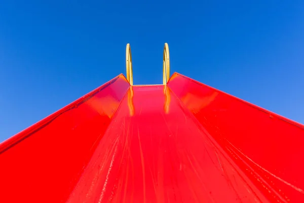 Playground Closeup Childrens Red Painted Slide Chute Looking Upwards Blue — Stock Photo, Image