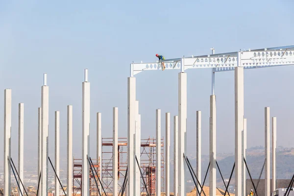 Construction Worker High Beams Columns