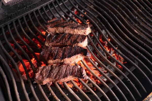 Steak on glowing charcoa — Stock Photo, Image