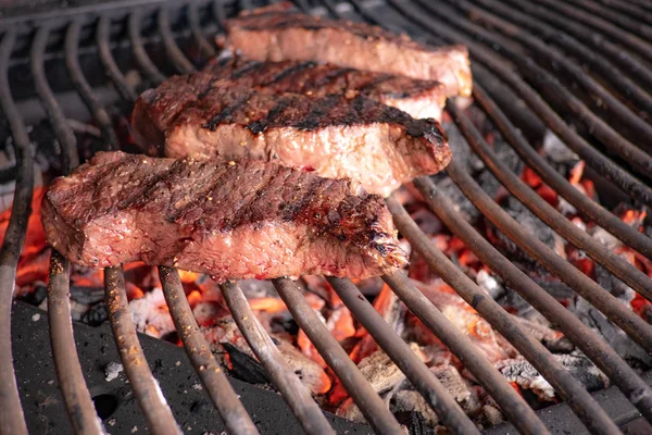 Steak on glowing charcoa — Stock Photo, Image