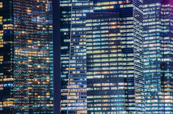 Close - up of a highly-detailed night windows pattern of modern metropolis.