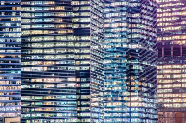 Close - up of a highly-detailed night windows pattern of modern metropolis.