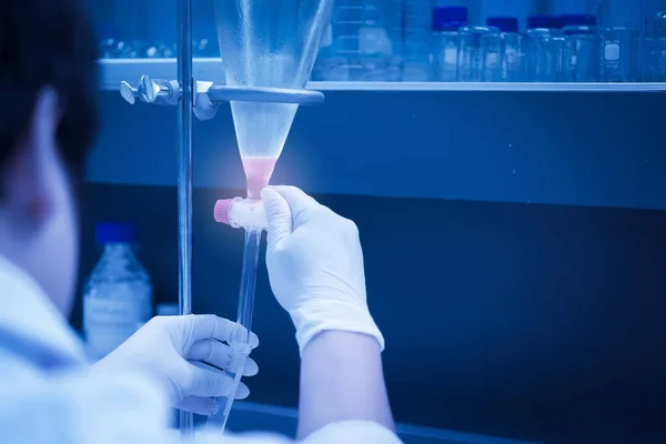 Scientist mix chemicals with The shake machine Before the experiment.Mixture laced with samples into test tubes,Thailand scientist working in the lab