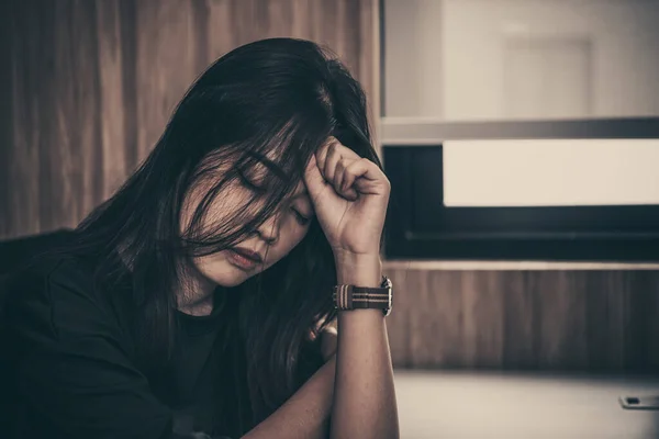 Close up sad beautiful asian woman from unrequire love,she think so much about boyfriend,life without love,sad woman heartbreak concept,sad woman concept on dark tone