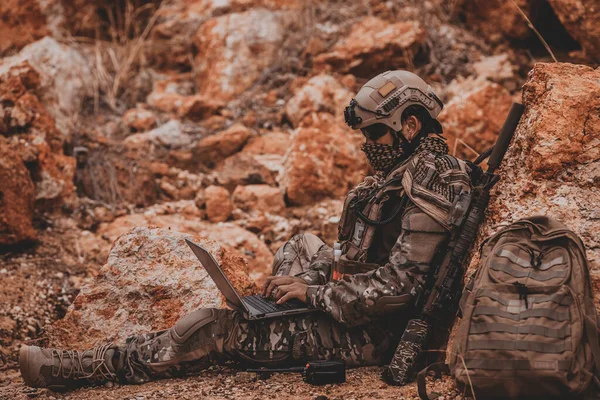 Soldiers of special forces on wars at the desert,Thailand people,Army soldier use laptop for see map with satellite,Using Radio For Communication During Military Operation