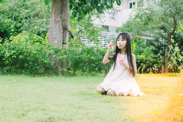 Cute Little Asian Girl Playing Soap Bubbles — Stock Photo, Image