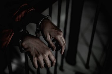 Hands of woman desperate to catch the iron prison,prisoner concept,thailand people,Hope to be free. clipart