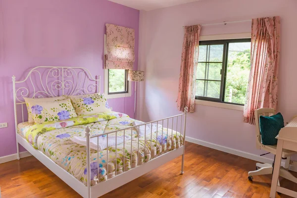 Interior of modern bedroom with Parquet floors on a sunny day,colorful bedroom style