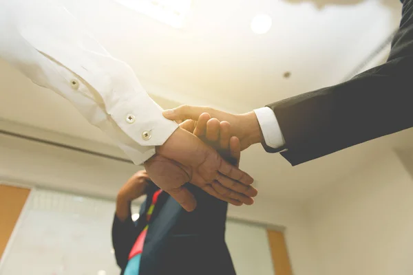 Three business people touch hand,teamwork  concept