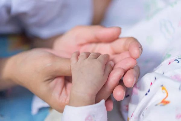 Closeup Hand Asian Baby Bed — Stock Photo, Image