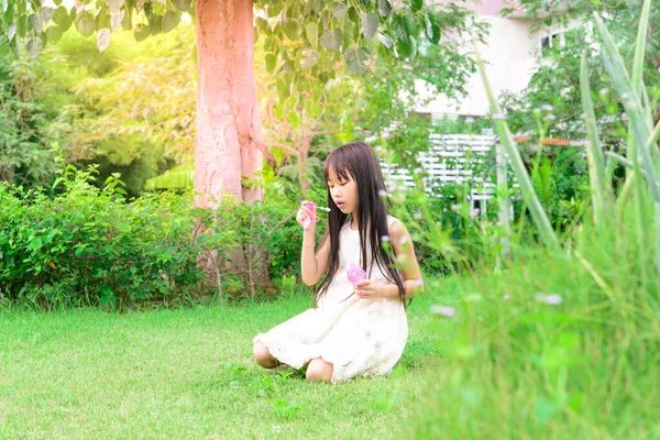 Cute Little Asian Girl Playing Soap Bubbles — Stock Photo, Image