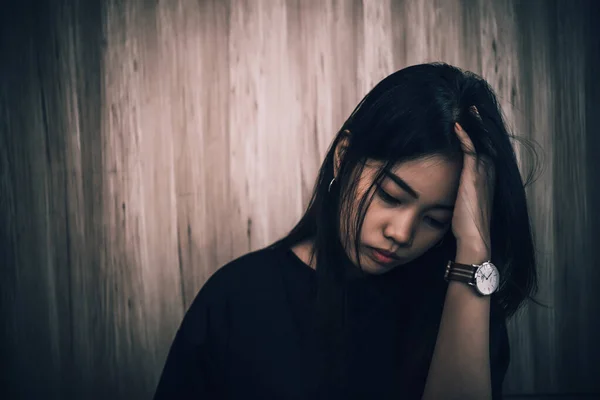 Close up sad beautiful asian woman from unrequire love,she think so much about boyfriend,life without love,sad woman heartbreak concept,sad woman concept on dark tone