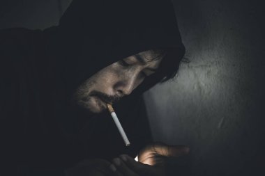 Asian men are drug addicts,Thailand no to drug concept,The bad guy drugs in the desolate,A man smoking
