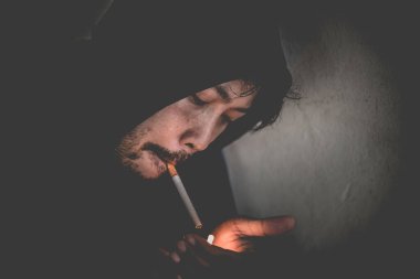 Asian men are drug addicts,Thailand no to drug concept,The bad guy drugs in the desolate,A man smoking