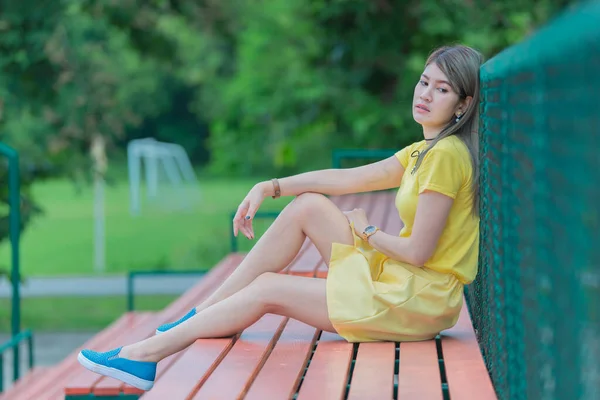 Cool Asian hipsters girl wear yellow dress posing for take a photo,lifestyle of modern woman,Thai people in hippie style,Chill day for relax