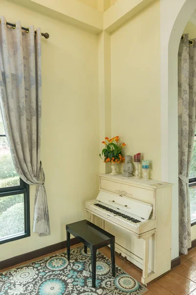 Living room with old wooden piano for relax time