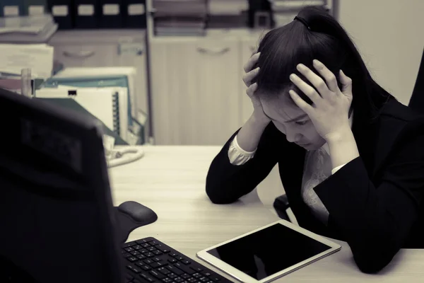 Asian businesswoman stress from hard work,Thai worker woman working in the office,Dark tone