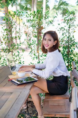 Young Beautiful thai woman work at coffee shop,beautiful smile,business girl,slender
