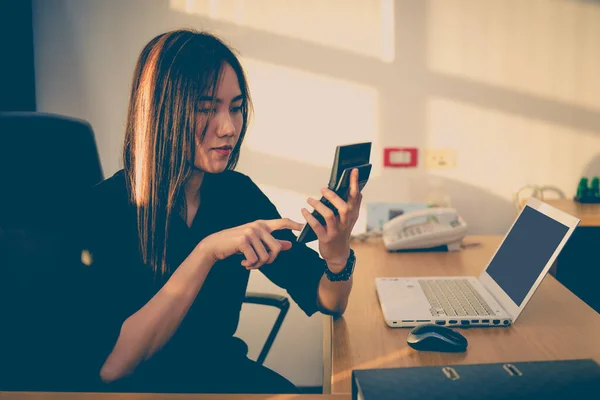 asian officer woman thinking about work