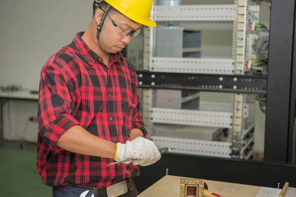 Technician working at site work,Labor day concept,Thailand people,Worker checking product