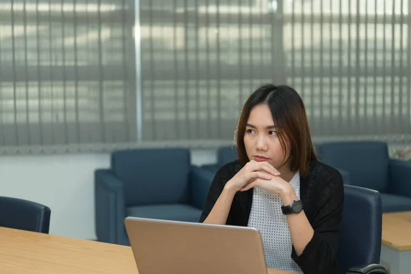 Asian businesswoman stress from hard work,Thai worker woman working in the office,Dark tone