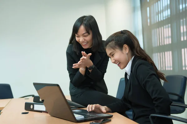 Two business woman happy concept,  success work,Discuss about project of work,Thailand people