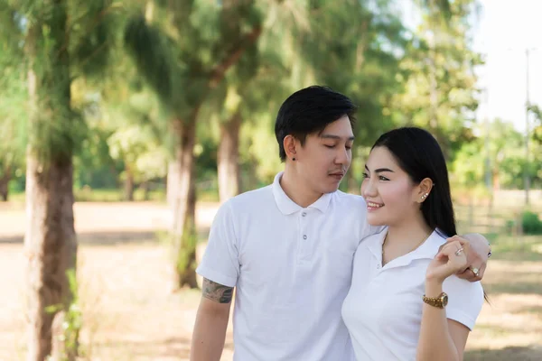 Portrait of young Asian couple in sunny day