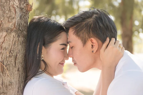 Portrait of young Asian couple in sunny day