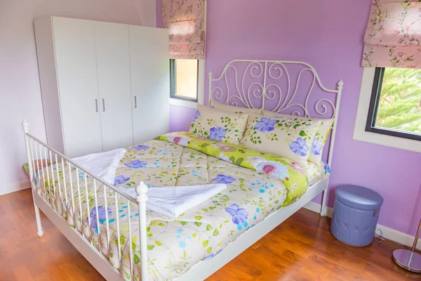 Interior of modern bedroom with Parquet floors on a sunny day,colorful bedroom style