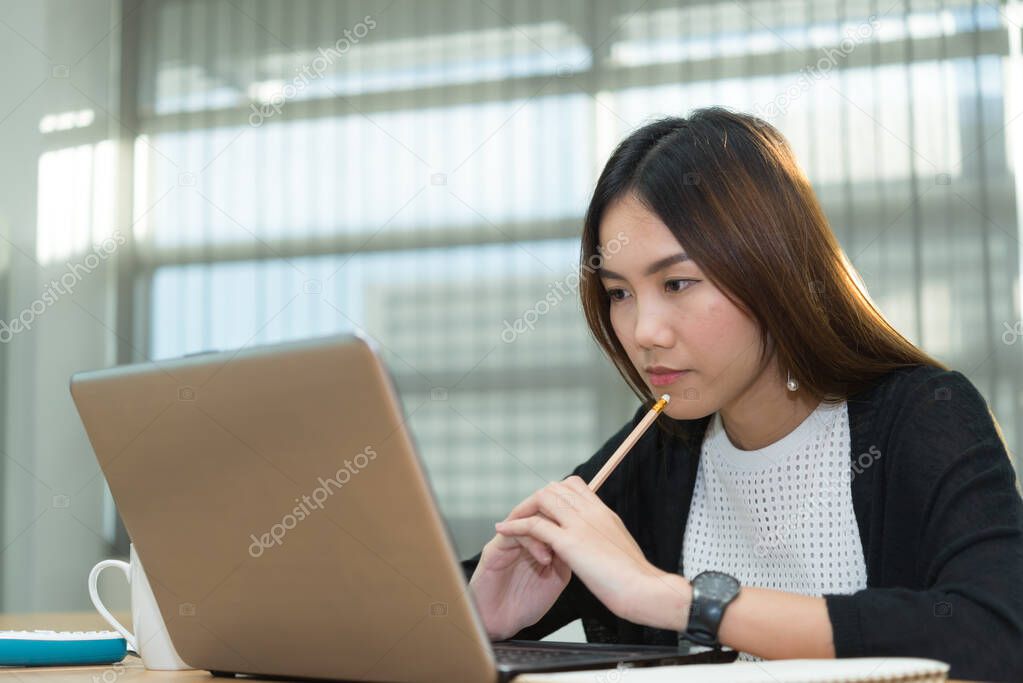 Asian businesswoman stress from hard work,Thai worker woman working in the office