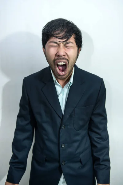Asian Angry handsome man isolated on orange background