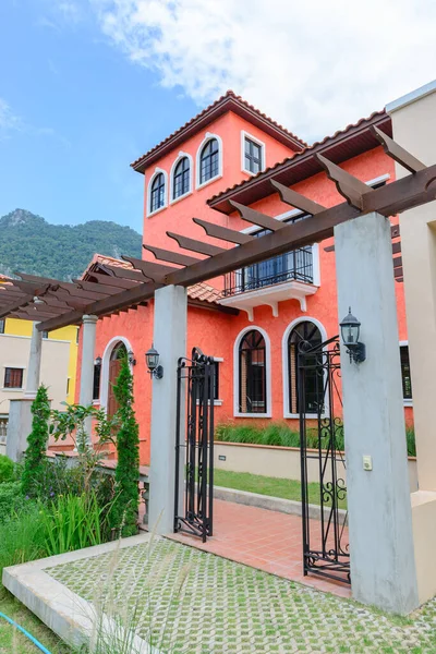 Red home tuscany style in khaoyai resort at nakhonratchasima,vivid,sunny day,beautiful sky