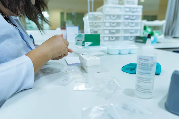 Asian scientist working in the lab,Experiment for customer,Using the formula, the physics and chemistry to calculate the value of the experiment,Thailand people