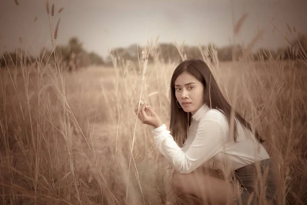 Sad asian woman at field vintage style,she very sad from unrequited love
